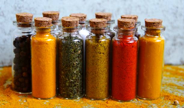 istock Vertical shot of various spices in small glass bottles. 1463752962