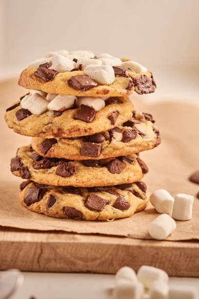 istock Vertical closeup of chocolate chip cookies and marshmallows. Shallow focus. 1463754759