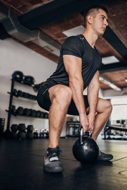 istock Man weightlifting in gym 1463755169
