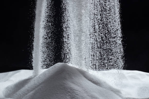 istock White quartz sand pours on a black background 1463756367
