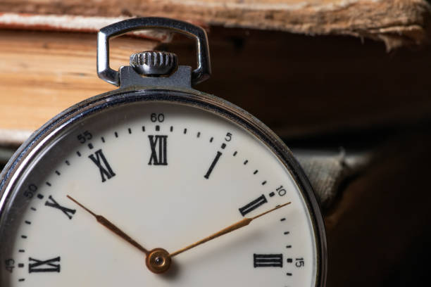 istock Pocket Watch and Old Book in Vintage Style 1463756767