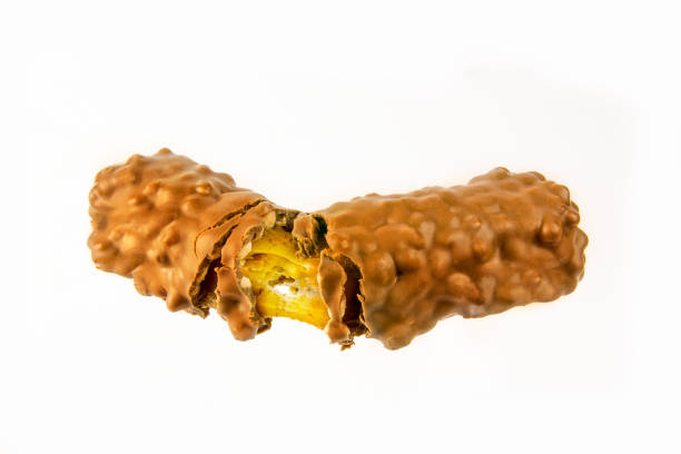 istock Close up of a broken candy bar on an isolated white background 1463757992