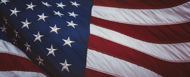 Close up of American flag USA on plain background