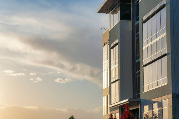 istock Modern building with huge glass windows at sunset 1463764524