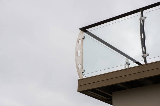 istock Glass balcony on a modern house with under a gloomy gray sky 1463764603