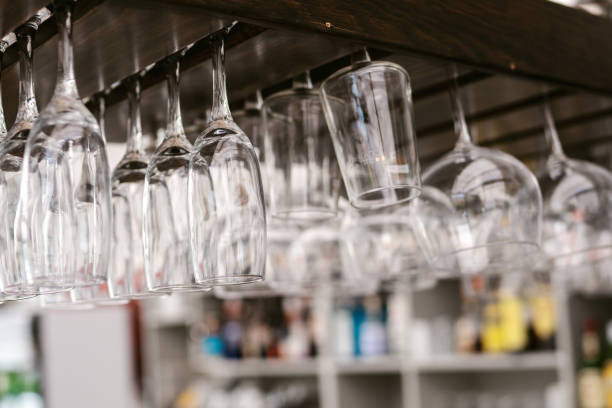 istock Glass cups hanging on a shelf to dry 1463765046