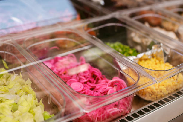 istock Closeup of the salad bar with marinated onions, peppers, corn 1463765049