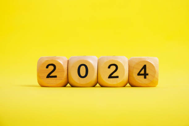 istock Wooden cubes with numbers 2024 yellow background. 1463766378