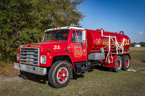 Fort Meade, FL - February 22, 2022: High perspective front corner view of a 1982 International S1954 Fire Truck at a local car show.