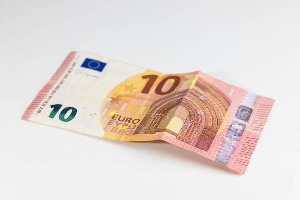 istock 10 euro banknote on a white background, rumpled banknote 1463768854