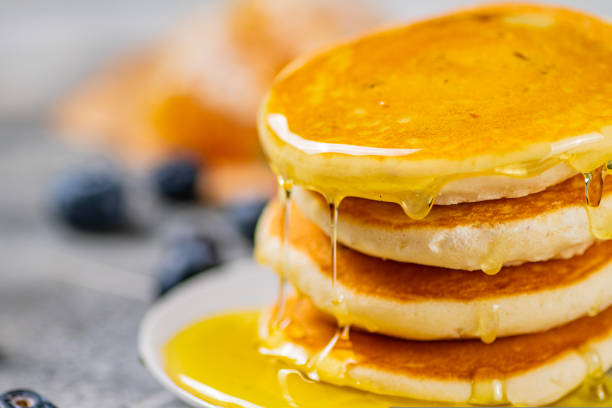 istock Pancakes with honey and berries on a plate. 1463770019