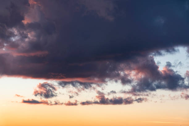 istock fantastic sky at sunset, sky background, orange clouds 1463770740