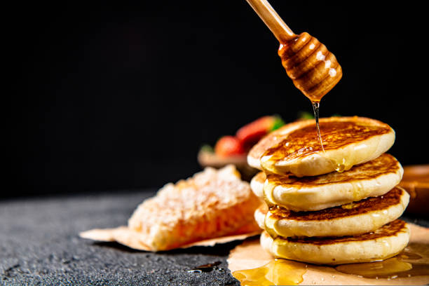 istock Homemade pancakes with honey on the table. 1463771695