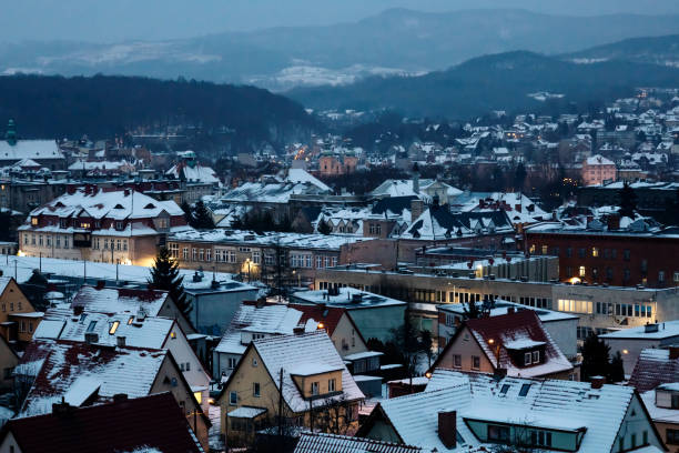istock Snow-covered town at night from above, winter city 1463772684