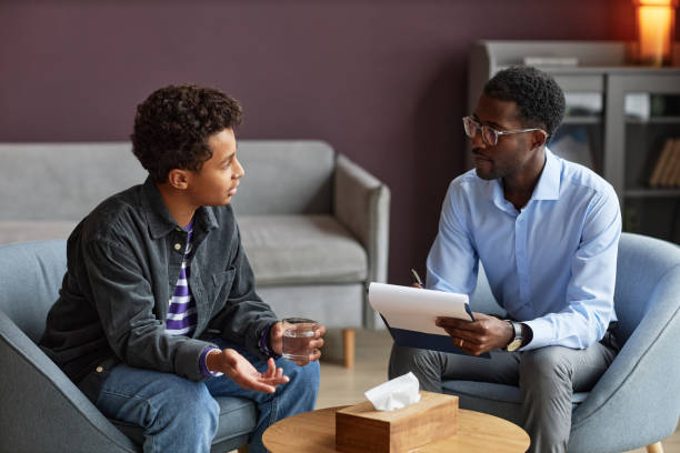 istock Boy Talking to Adolescent Psychologist 1463773305