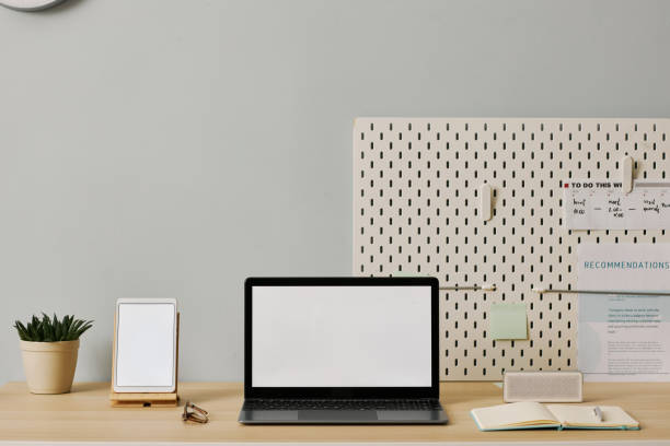 istock Minimal office setup with laptop screen mockup on desk 1463776593