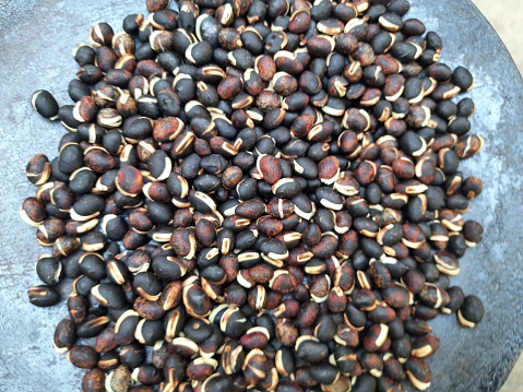 Lablab purpureus seeds. It is a species of bean in the family Fabaceae. Its other names lablab bean, bonavist bean pea, dolichos bean, seim, lablab, Egyptian kidney bean, Indian bean.