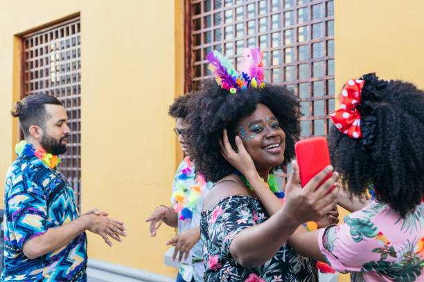 istock Tourist preparing carnival make-up in the street 1463778078