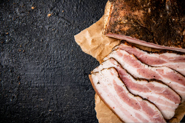 istock Fragrant pieces of pork lard on paper. 1463778484