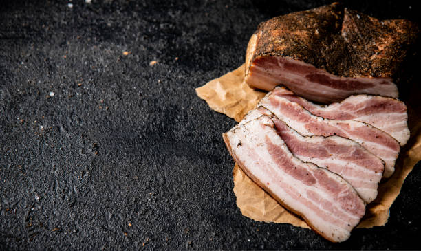 istock Fragrant pieces of pork lard on paper. 1463778627