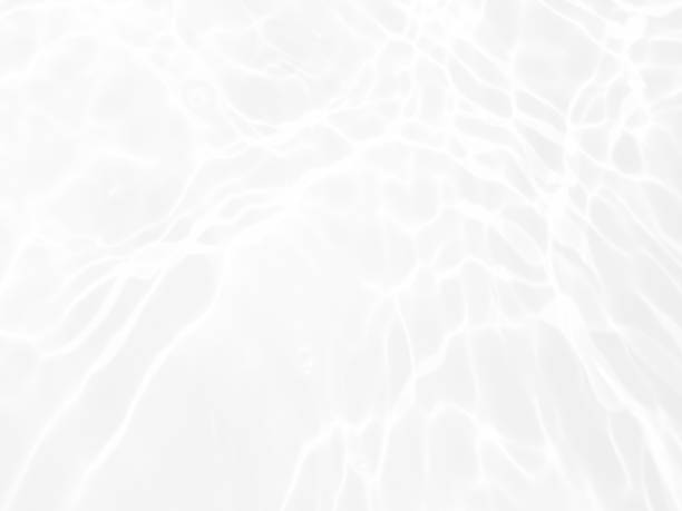 istock Defocus blurred transparent white colored clear calm water surface texture with splashes and bubbles. Trendy abstract nature background. Water waves in sunlight with copy space. White water shine 1463783728