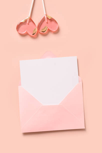 istock Valentine's day romantic vertical greeting card with blank and pink lollipops. 1463786806