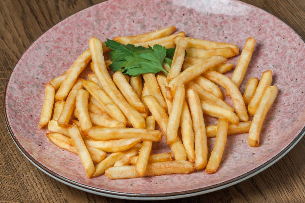 istock french fries with parsley in a pink plate 1463792607
