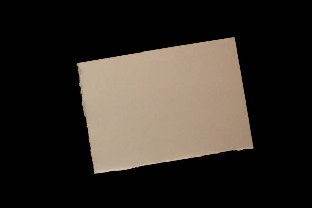 istock Torn paper piece isolated on black background 1463795846