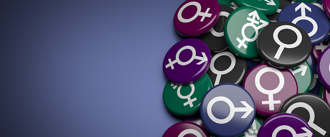 The gender symbols male, female, neutral, bisexual and transsexual on a heap.