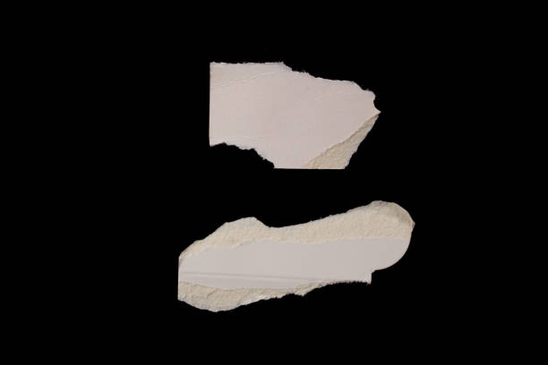 istock Torn paper piece isolated on black background 1463796526