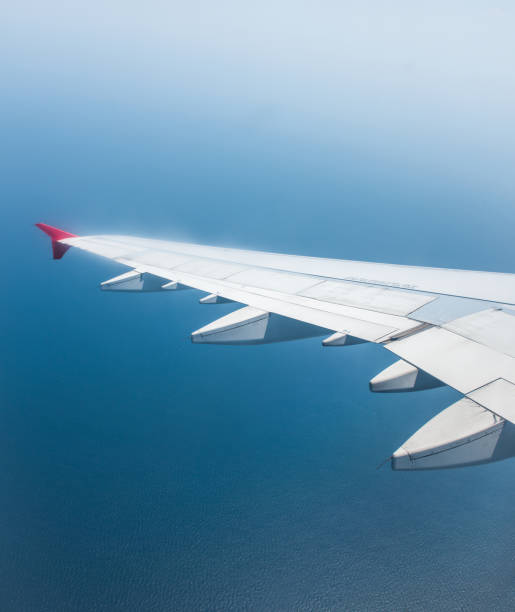 istock airplane wing with cloudy blue sky. beautiful sky. 1463797320