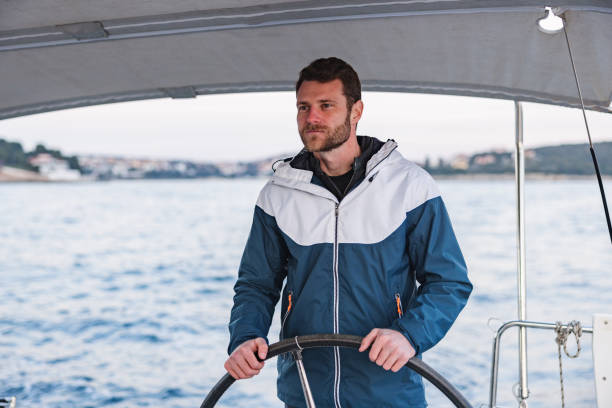 istock Caucasian Good Looking Sailor Smiling And Looking At The Horizon 1463800850