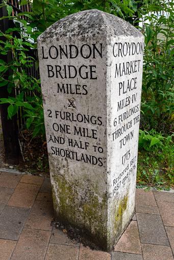 Beckenham (Greater London), Kent, UK. Old milestone at the junction of the High Street and Bromley Road in Beckenham showing distances from Beckenham.