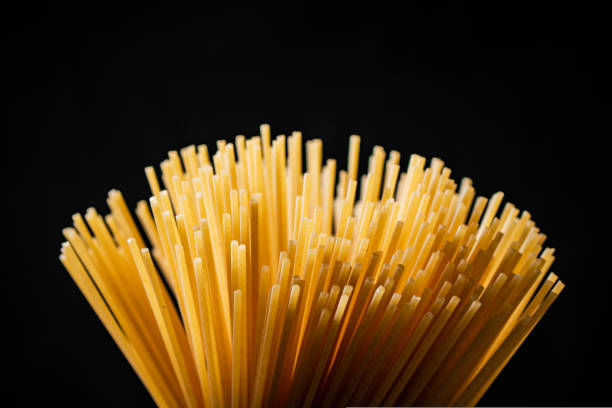 istock A fan of spaghetti dry on a black background. 1463809444