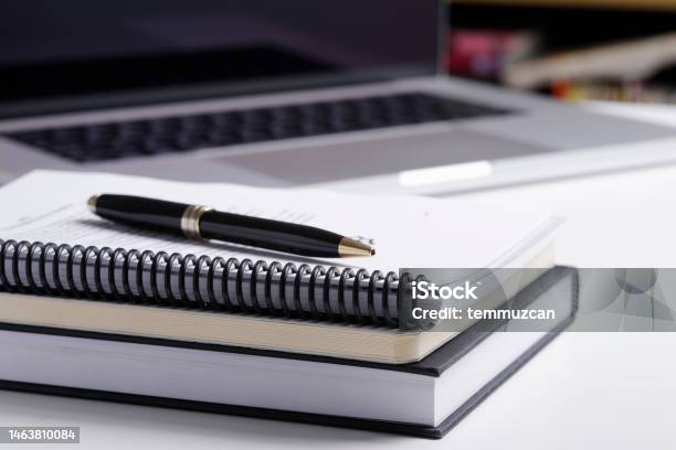 Close Up Of Notebook And Laptop Computer Stock Photo - Download Image Now - Note Pad, Pen, Book