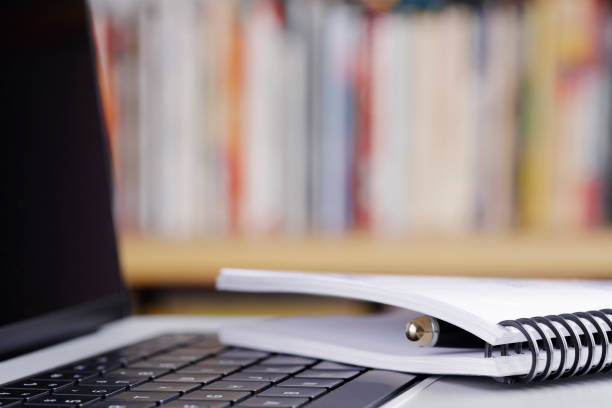Close up of notebook and  laptop computer at the library