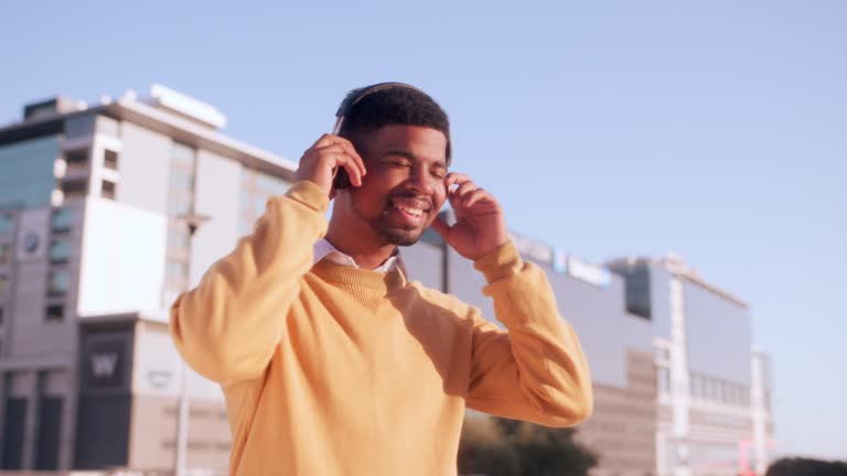 Smile, music and business black man dance in the city