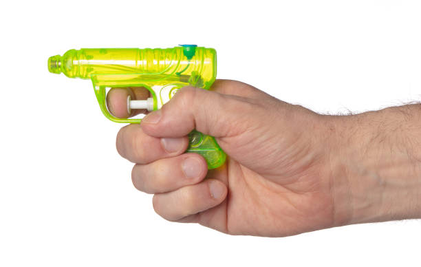 istock Hand holding plastic watergun toy 1463813150
