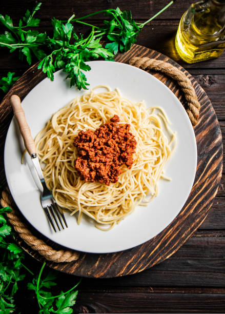 istock Delicious spaghetti bolognese with parsley. 1463814622