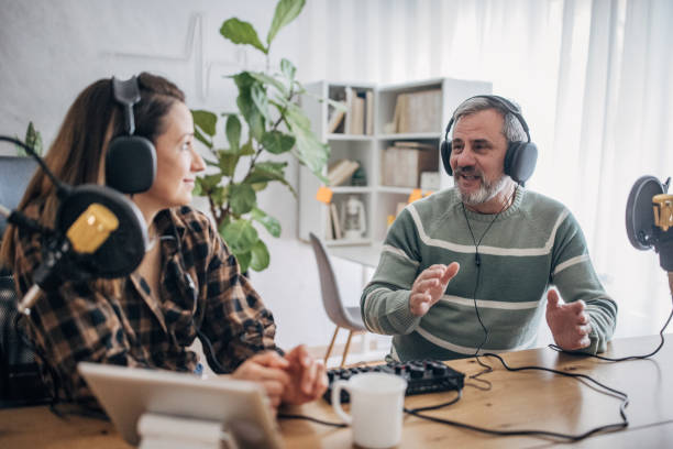 istock A radio host talks to an elderly man in the studio 1463815585