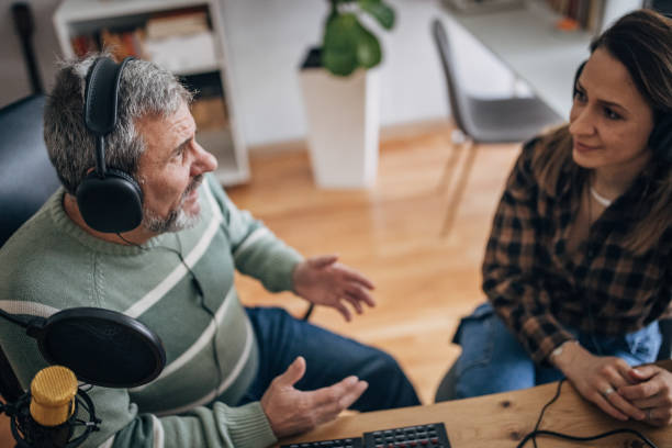 istock A radio host talks to an elderly man in the studio 1463815877