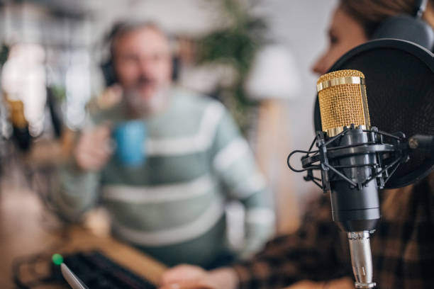 istock Podstaker, a young woman makes a podcast in the studio 1463816037