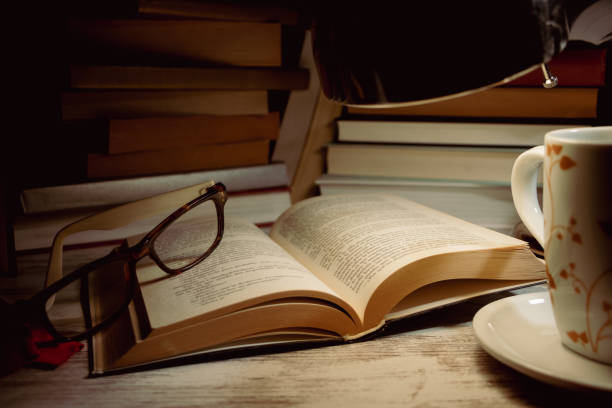 istock open book with glasses on top and a mug 1463820432