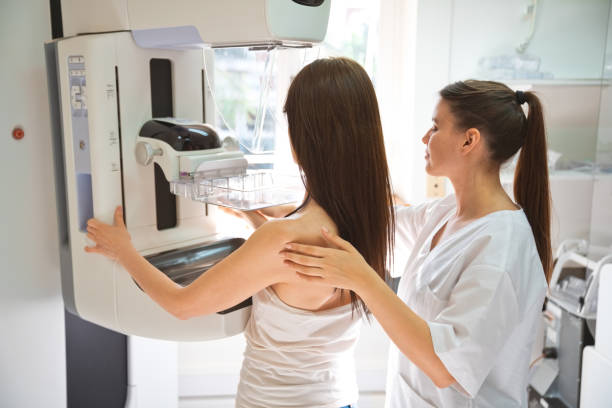 istock Nurse and patient during Mammography test in examination room 1463823095