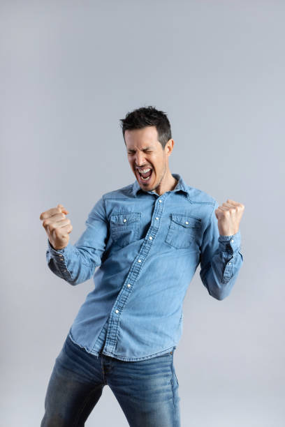 istock Excited young Man with casual jeans clothes doing winner gesture 1463823531
