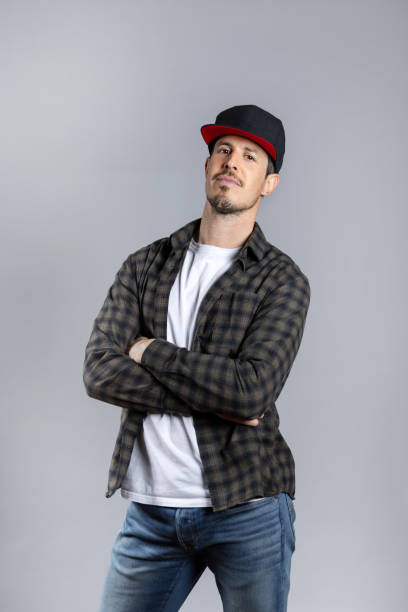 istock Man in casual clothes posing looking at camera isolated on gray background 1463823648