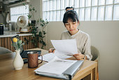 Woman works at home. And during an online consultation with a tax agent.