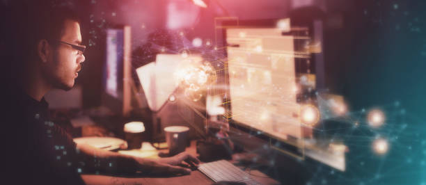 istock Digital, hologram and night with a designer man at work in a dark office for overtime on a cybersecurity project. Overlay, software or innovation with a male programmer or developer working on design 1463824064