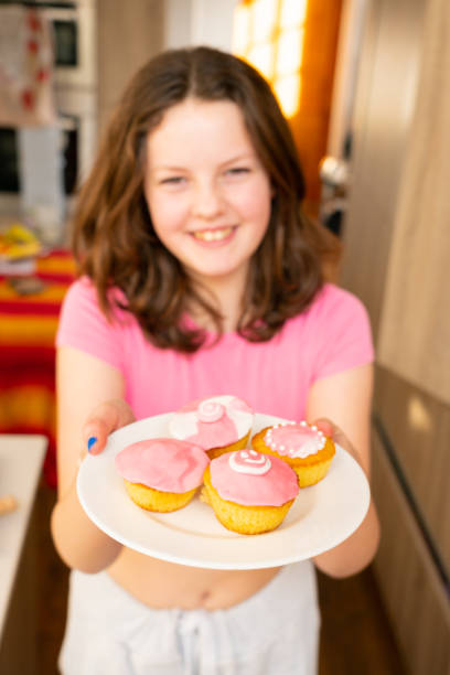 istock Young Girl Baking Cupcakes 1463824881