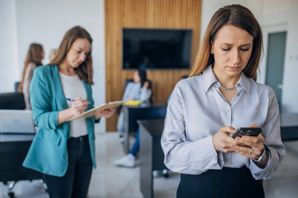 istock Business woman using mobile phone in the office 1463825045